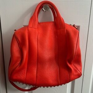 Authentic Alexander Wang Rocco Orange Pebbled Leather Studded Satchel.